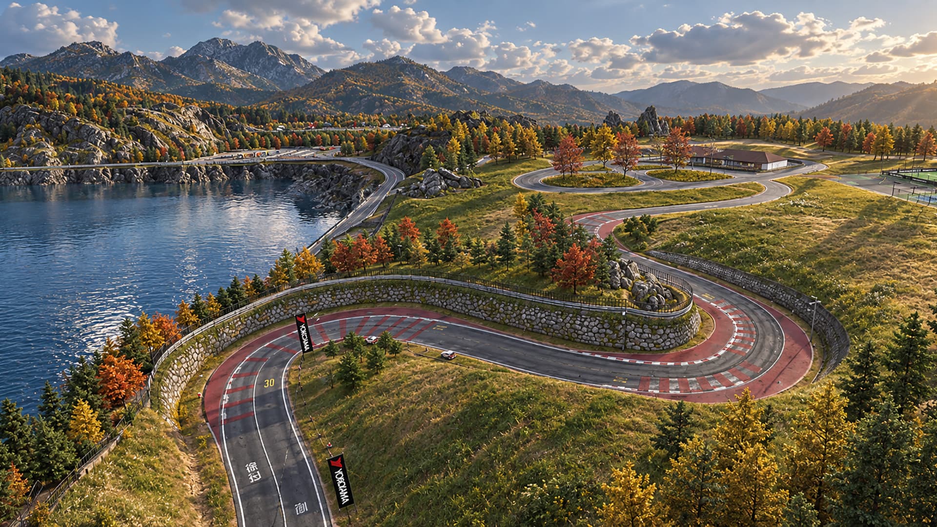 Traffic Racer Pro Drift Mansion multiplayer map — aerial view of a winding red and white kerbed circuit on a hillside above a lake, surrounded by autumn forest and mountains